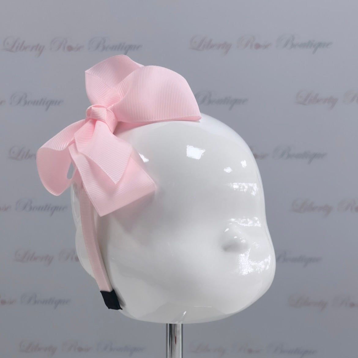 Bowtique London Bow HeadBand Pink
